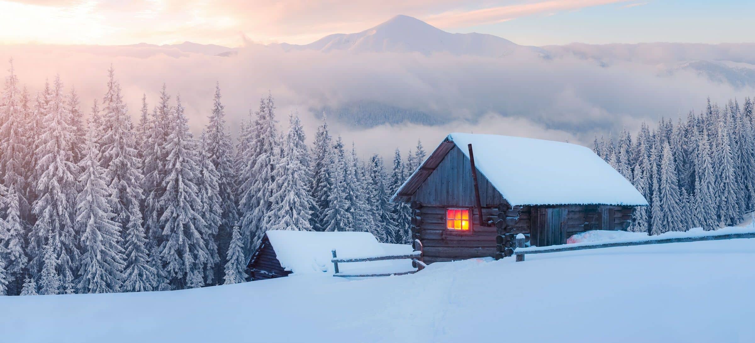 Fantastic winter landscape with wooden house in snowy mountains ©Ivan Kmit - stock.adobe.com