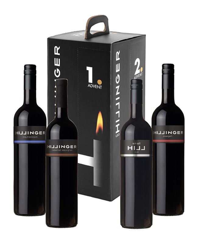 Hill Adventsbox: Box im Hintergrund, vier Weinflaschen im Vordergrund.