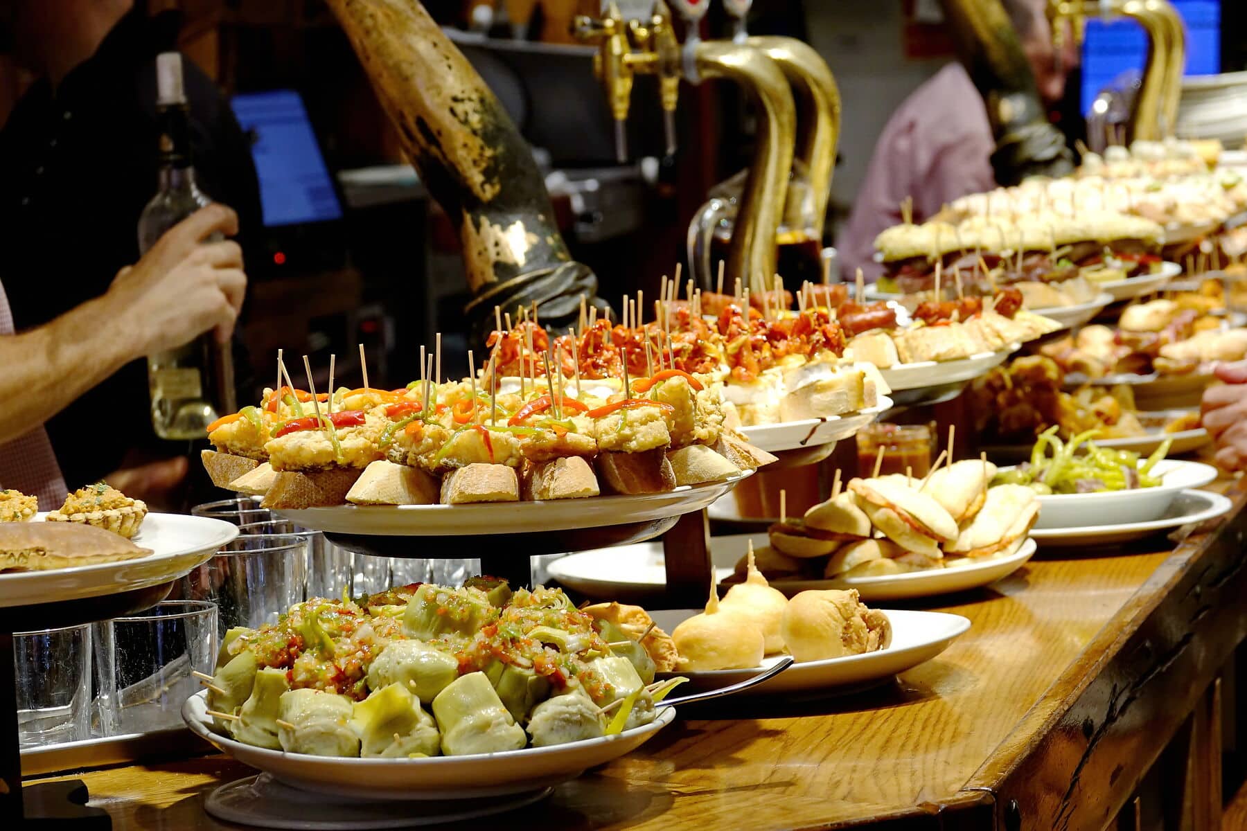 Tapas Bar A tapas bar in San Sebastian with delicious pintxos, the traditional appetizers of the Basque country. San Sebastian, Spain - August 2018