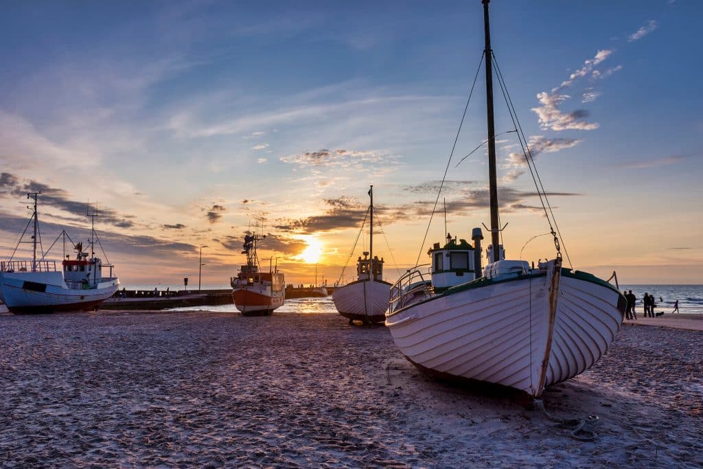 Fishing both on the beach at løkken at sunset